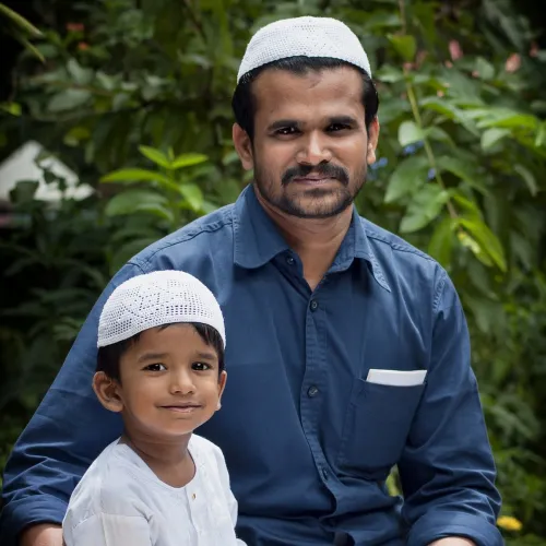 An image of a man and a child sitting outside